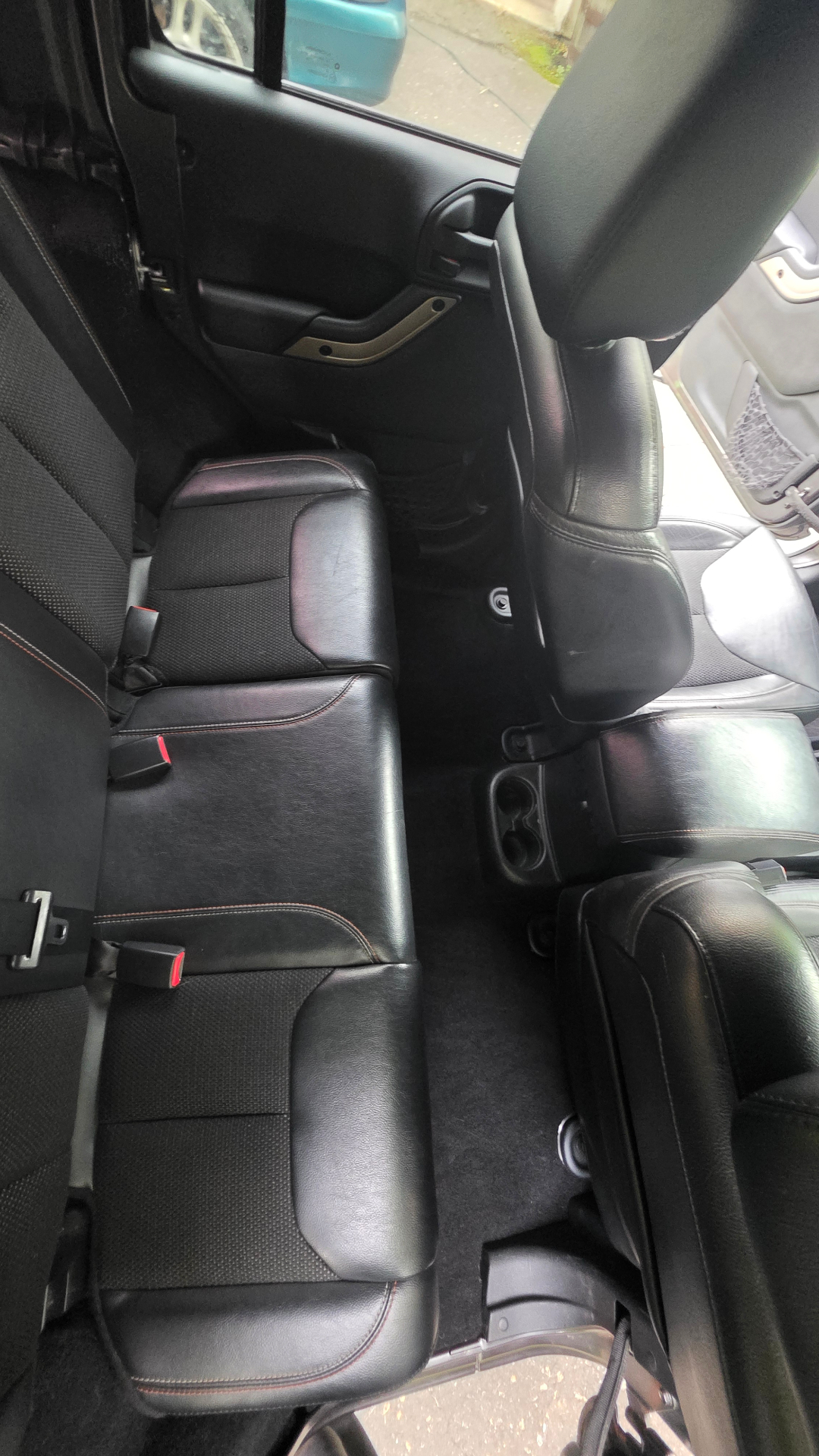 Rear bench and floor carpets vacuumed and shampooed