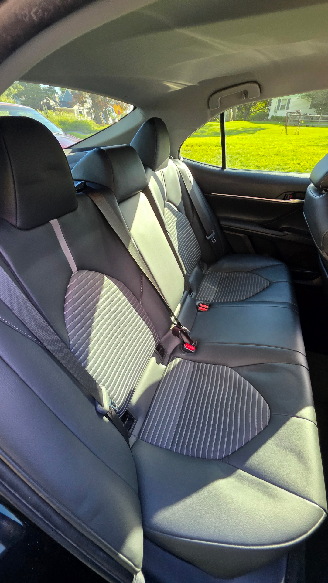 Rear seats cleaned and conditioned after a mobile detail