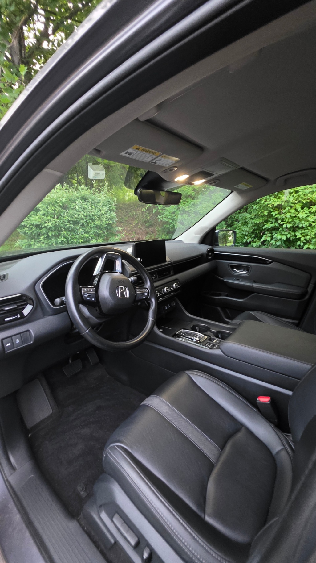 SUV front cabin detailed with clean carpets and leather seats